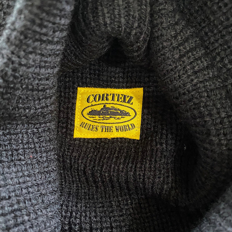 CAGOULE EN TRICOT CORTEIZ NOIR JAUNE
